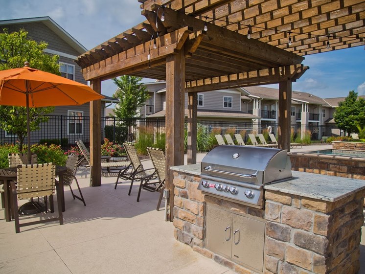 Outdoor Grill With Intimate Seating Area at The Manor Homes of Eagle Glen, Raymore, Missouri
